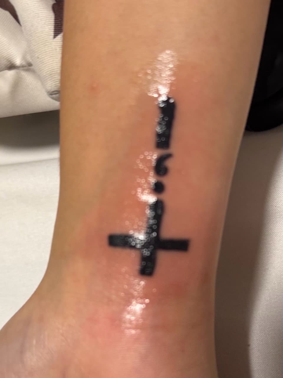 Black-work + Symbolic inverted cross tattoo on Wrist by Tattedbykai on TattMe