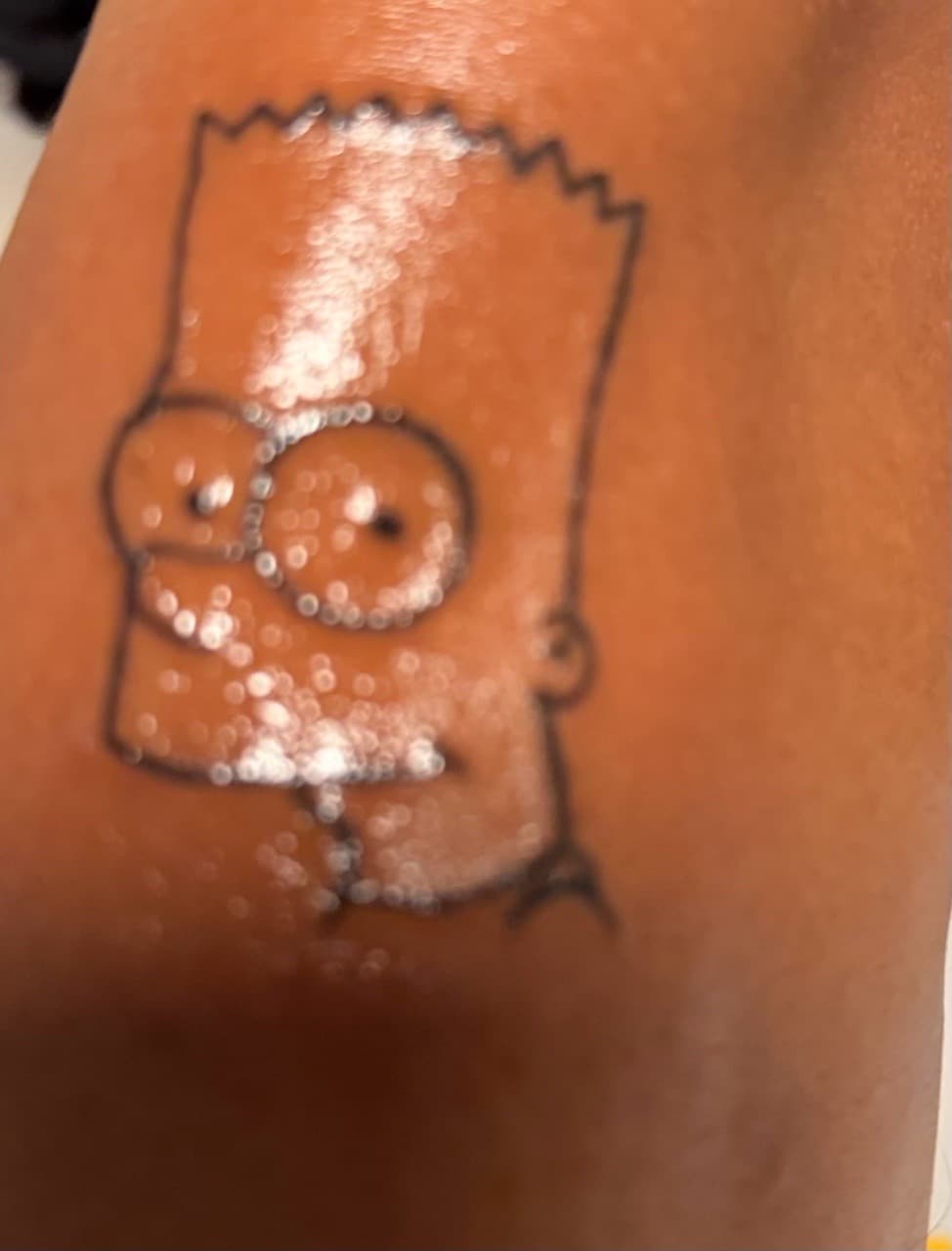 Cartoon + Pop Culture bart simpson tattoo on Upper Arm by Tattedbykai on TattMe