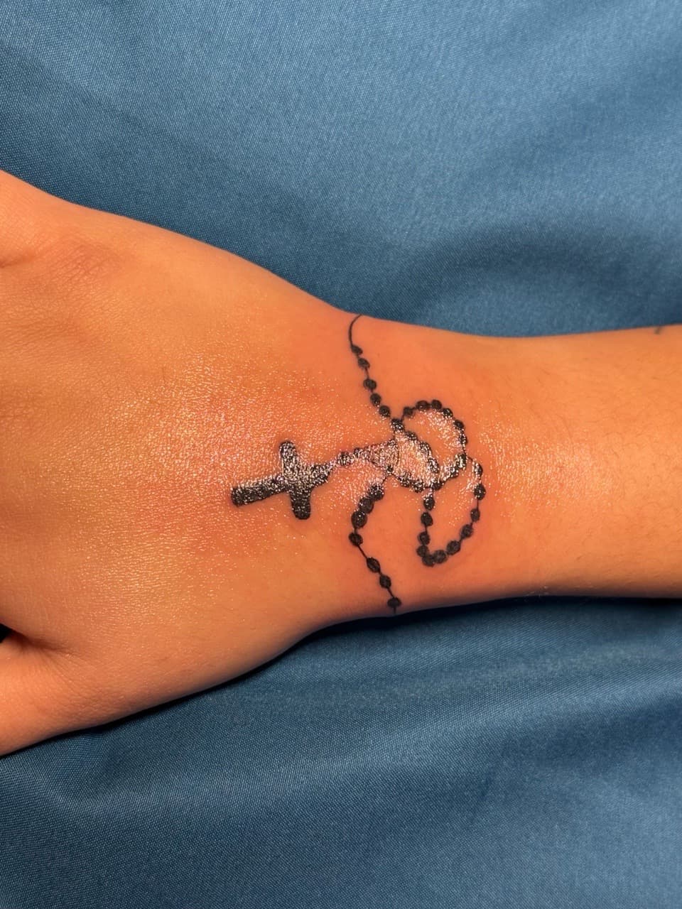 Fine Line + Black-work rosary tattoo on Wrist by Tattedbykai on TattMe