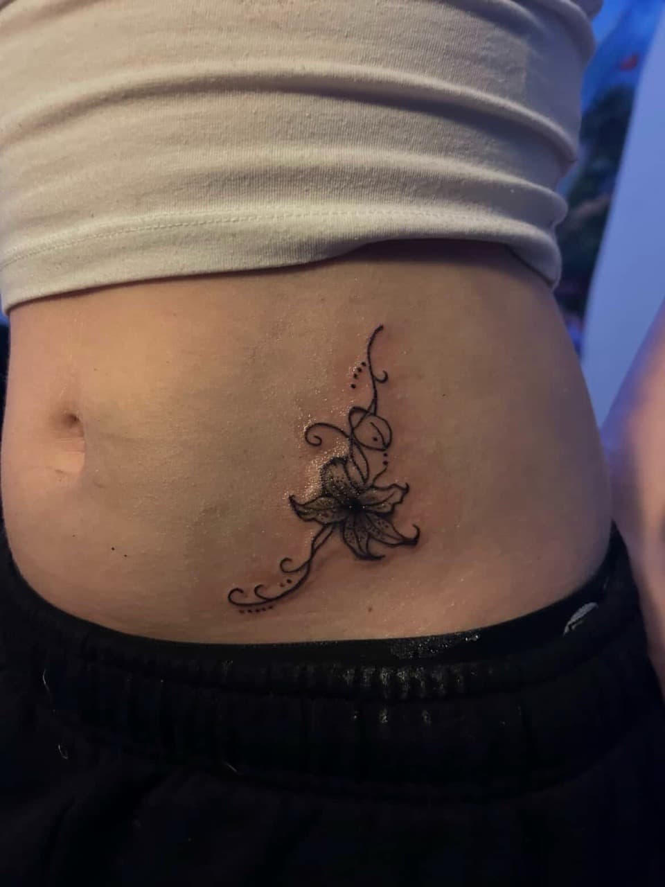 Fine Line + Floral flower tattoo on Stomach by tatsbyautumn on TattMe