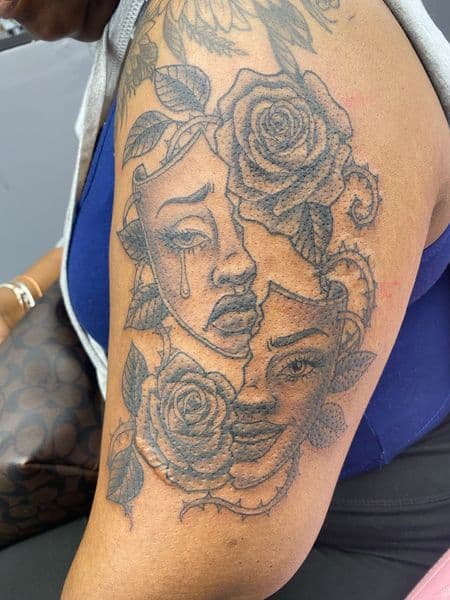 Black & Grey + Illustrative masks tattoo on Upper Arm by MissRitaBaby_Tattoos on TattMe