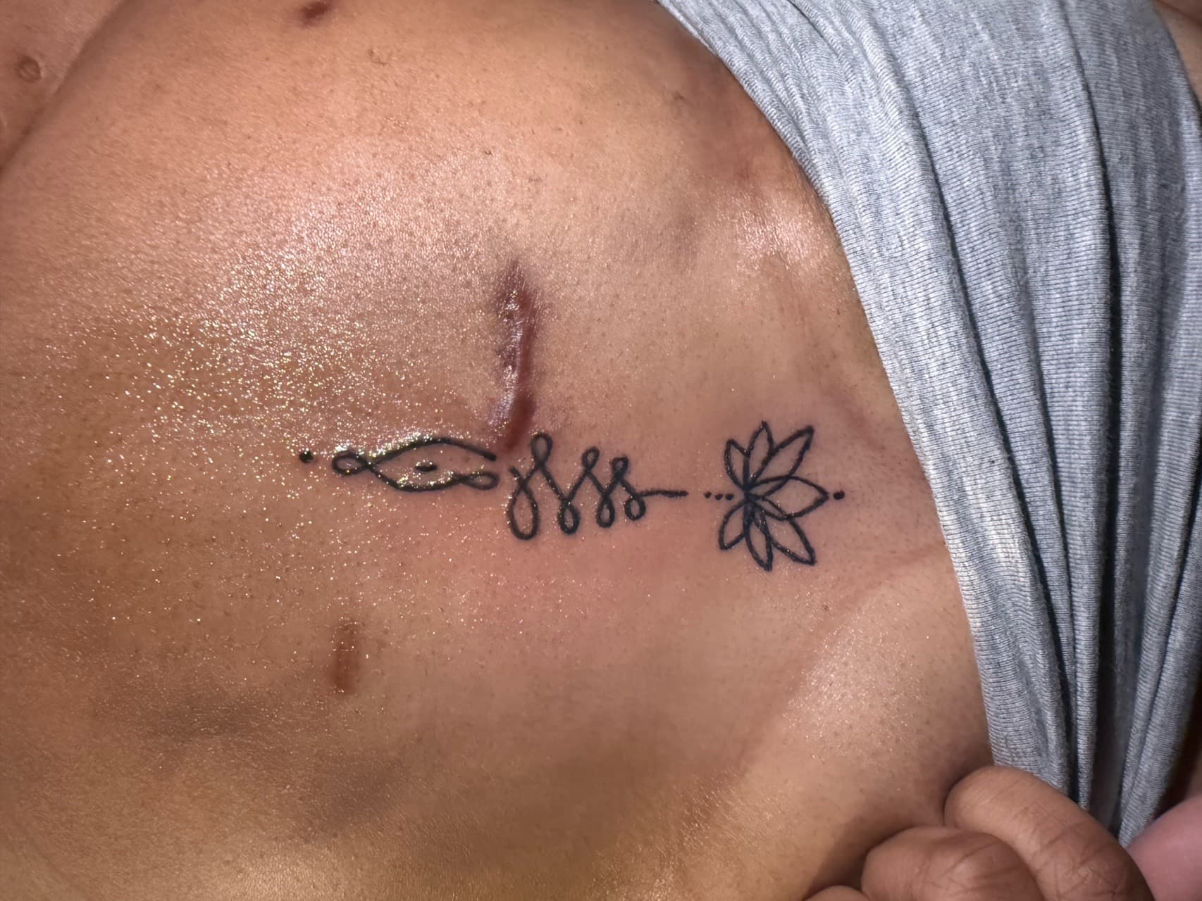 Fine Line + Minimalist lotus tattoo on Sternum by g4.inkz on TattMe