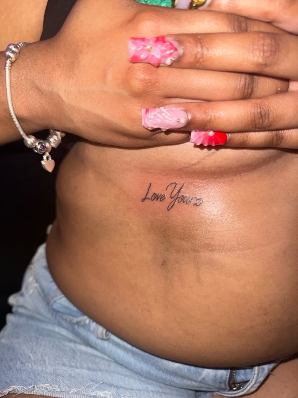 Script + Lettering love yours tattoo on Ribs by g4.inkz on TattMe
