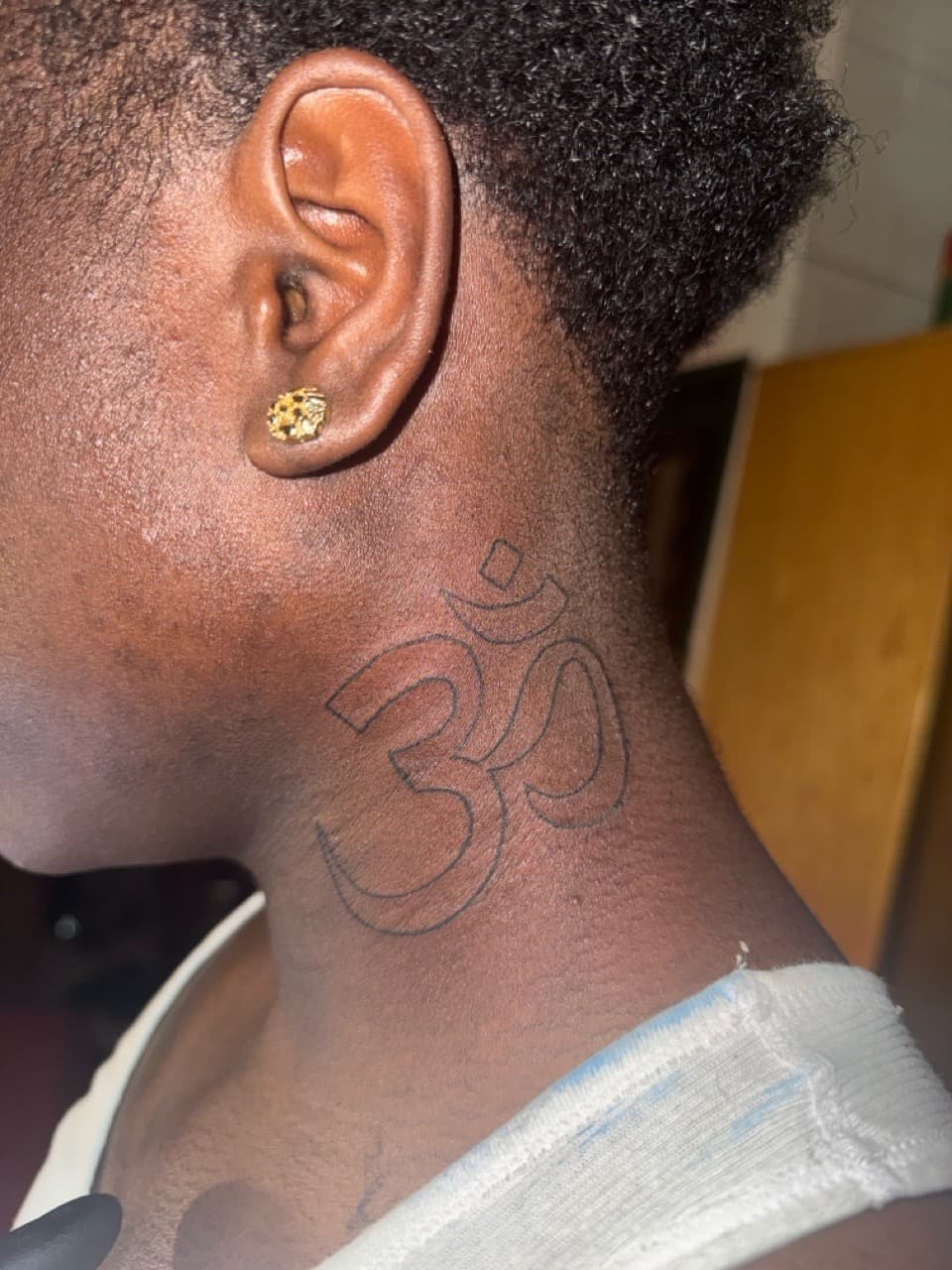 Fine Line + Line-work om symbol tattoo on Neck (Side) by g4.inkz on TattMe