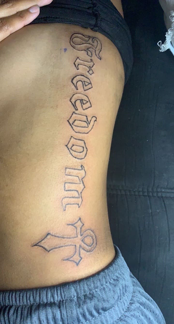 Lettering + Script freedom tattoo on Ribs by Braedan_Sterling on TattMe
