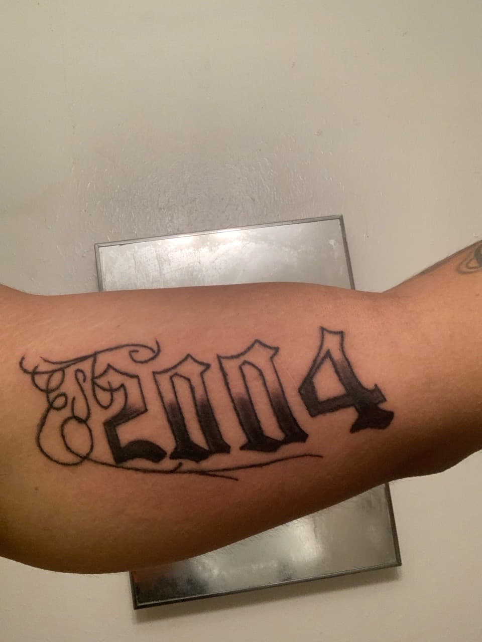 Lettering + Script numbers tattoo on Upper Arm by Braedan_Sterling on TattMe