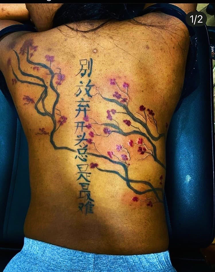 Japanese + Floral cherry blossoms tattoo on Upper Back by Fishscale_Images on TattMe