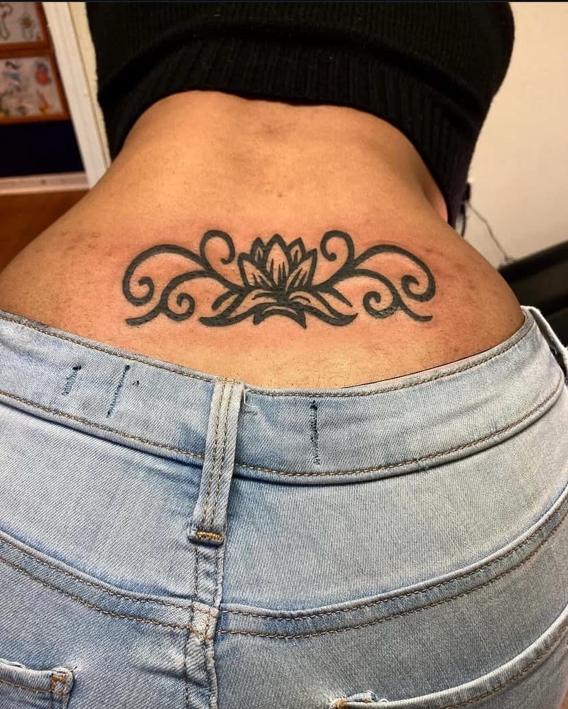 Black-work + Tribal lotus tattoo on Lower Back by Fishscale_Images on TattMe