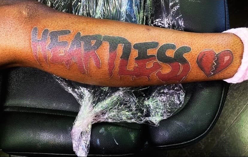 Lettering + Color heartless tattoo on Calf by Fishscale_Images on TattMe