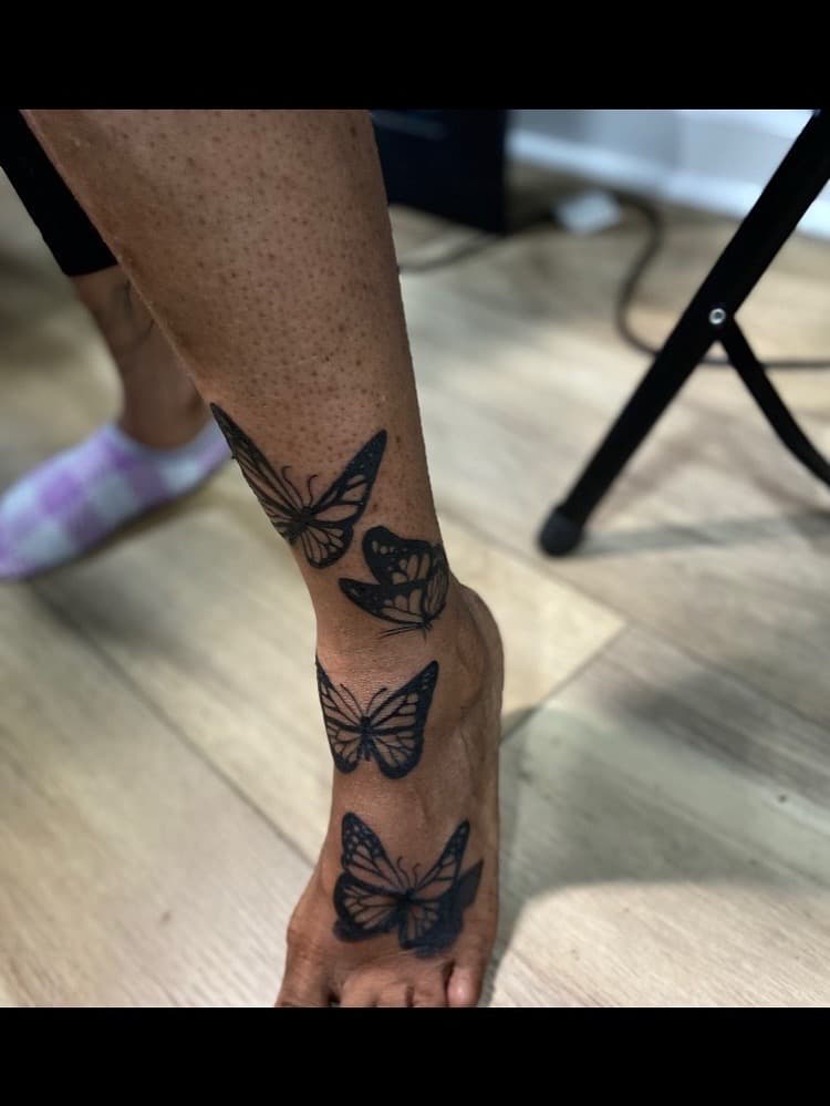 Fine Line + Black-work butterflies tattoo on Foot by Fishscale_Images on TattMe
