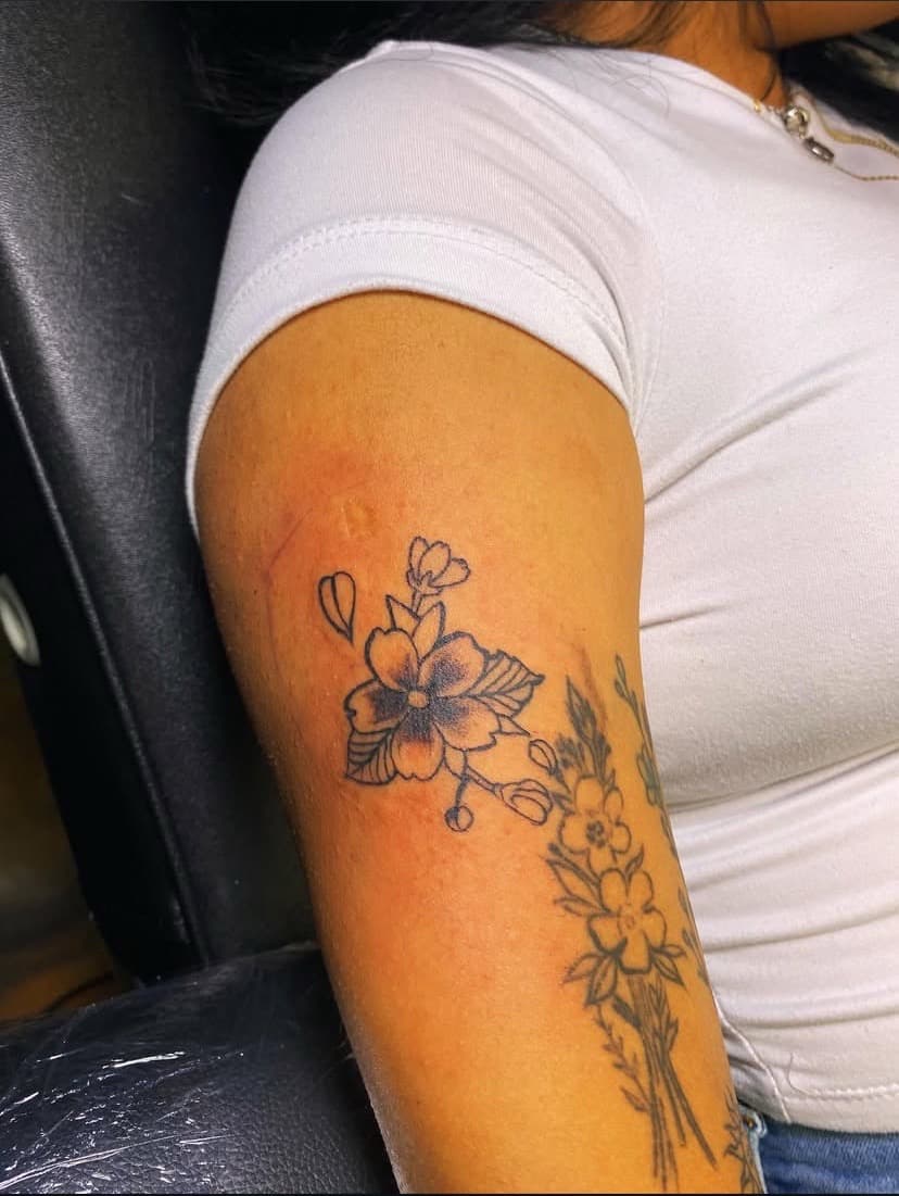 Floral + Line-work flowers tattoo on Upper Arm by Fishscale_Images on TattMe