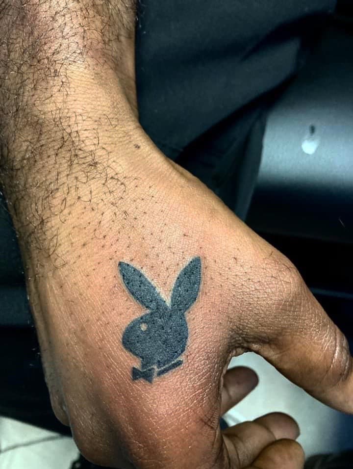 Black-work + Pop Culture playboy bunny tattoo on Hand by Fishscale_Images on TattMe
