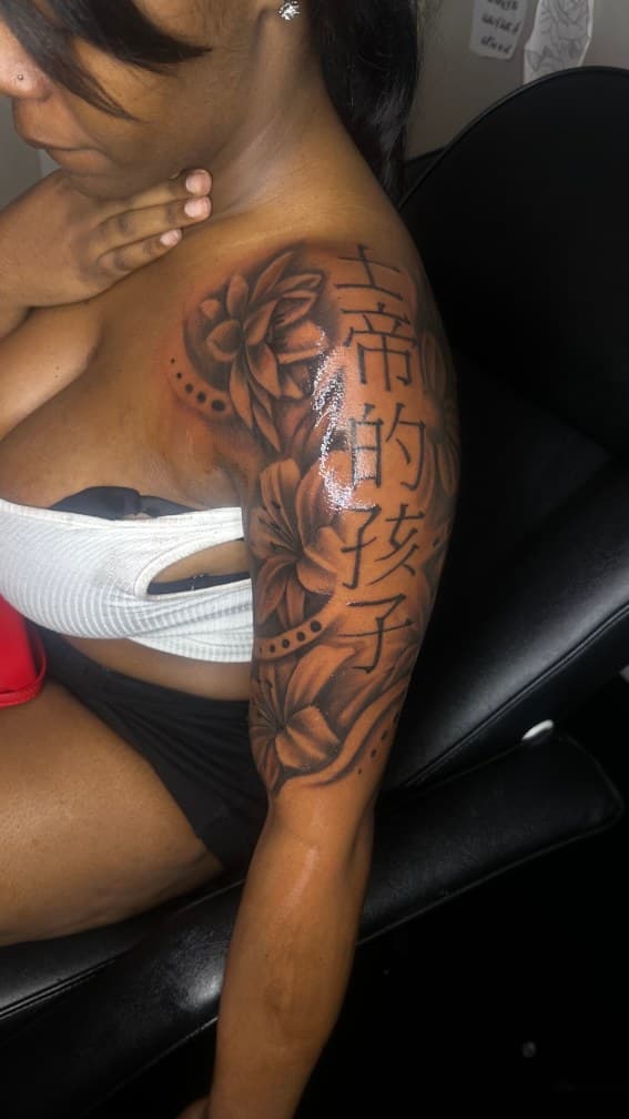 Black & Grey + Floral flowers tattoo on Upper Arm by CorieTheArtist on TattMe