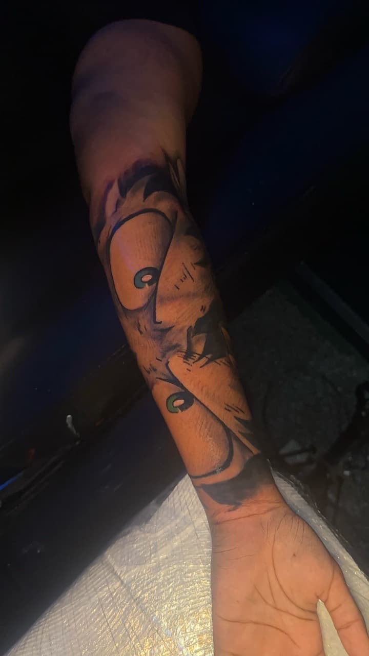 New School + Cartoon face tattoo on Forearm by CorieTheArtist on TattMe