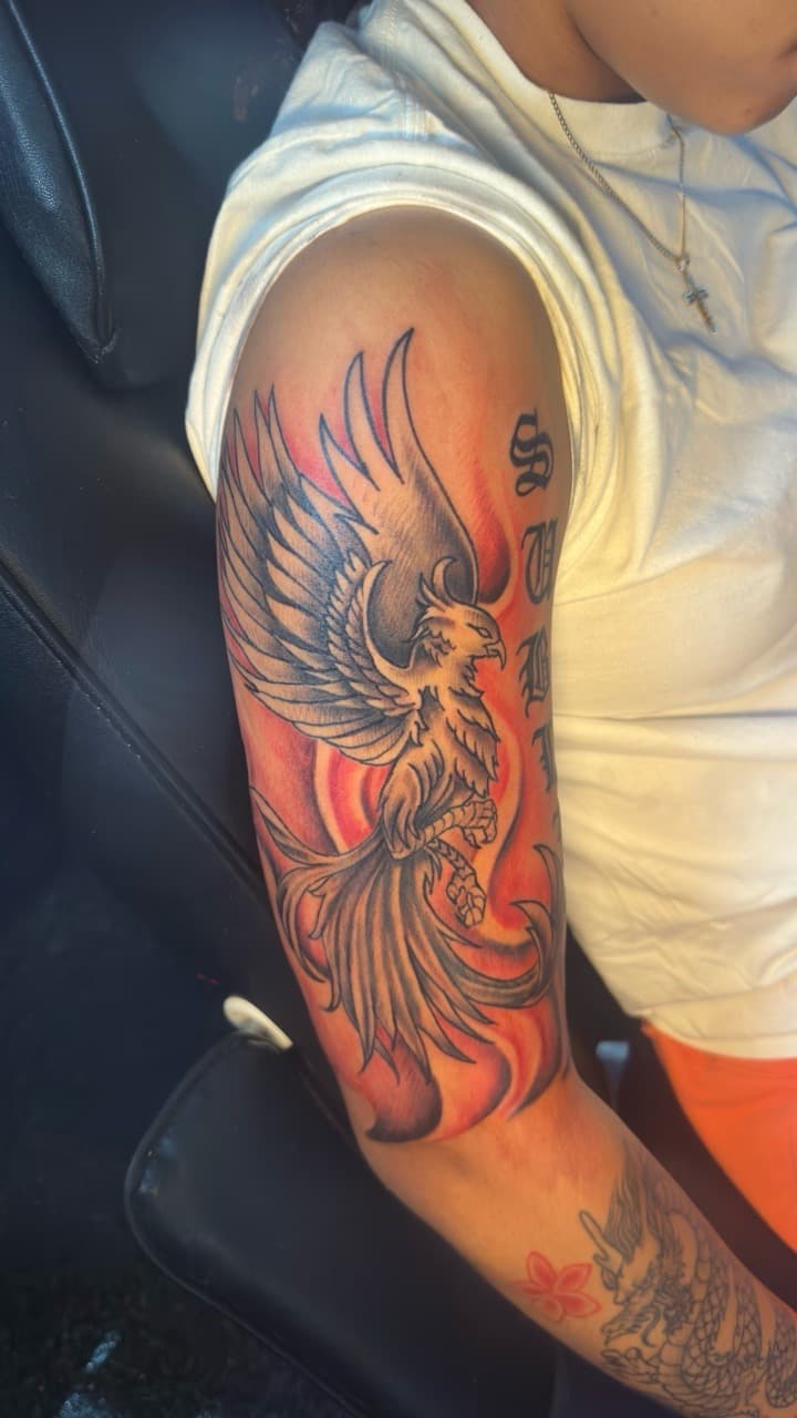 Black & Grey + Color phoenix tattoo on Upper Arm by CorieTheArtist on TattMe