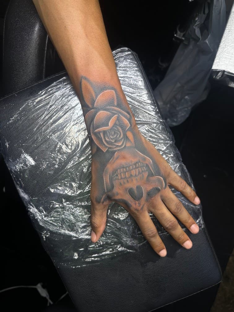 Black & Grey + Illustrative skull tattoo on Hand by CorieTheArtist on TattMe