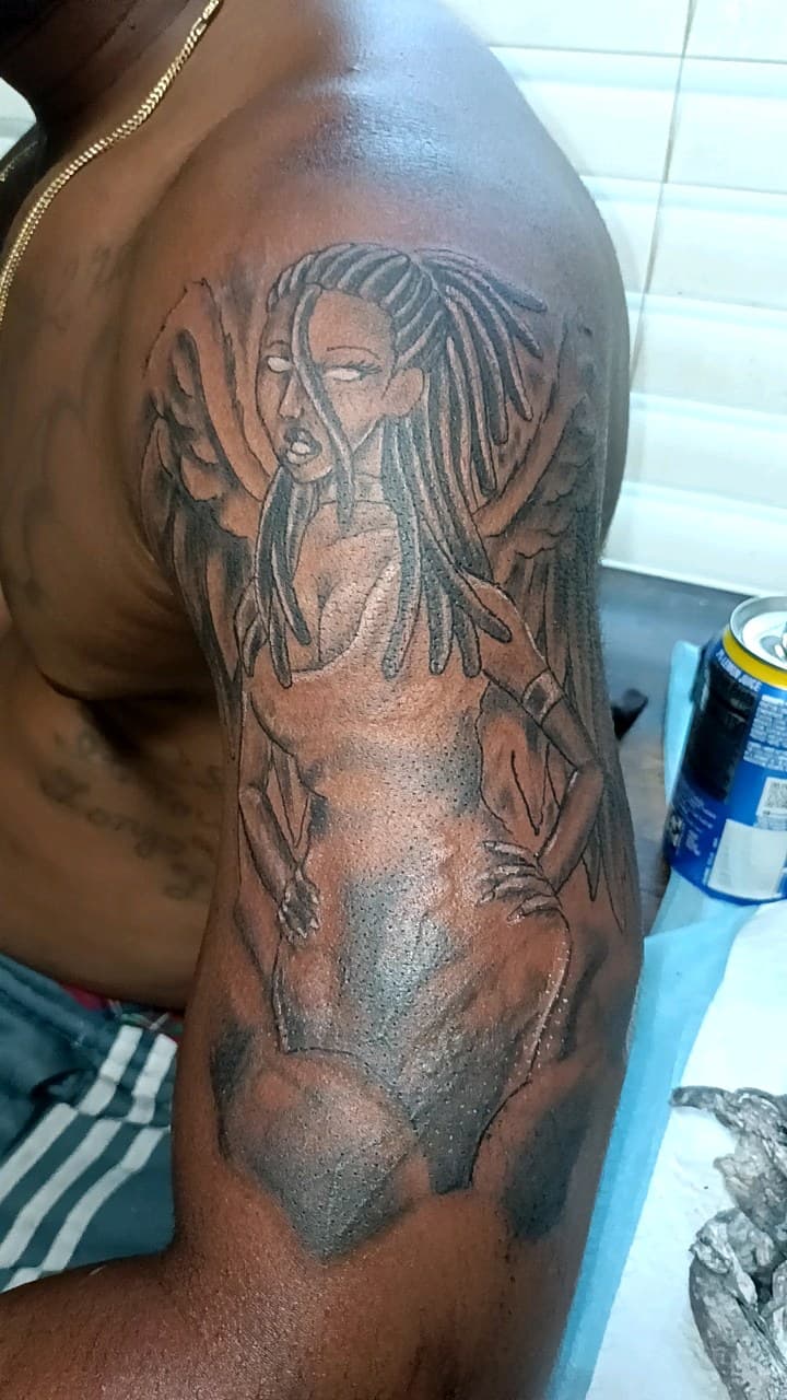 Black & Grey + Illustrative woman tattoo on Upper Arm by TattmanW on TattMe