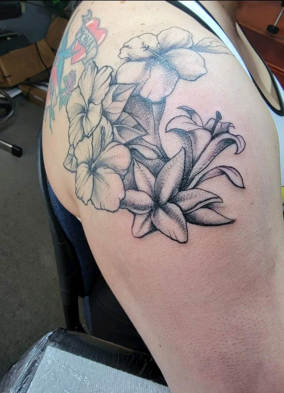 Black & Grey + Floral flowers tattoo on Upper Arm by Dank_N_Paint on TattMe