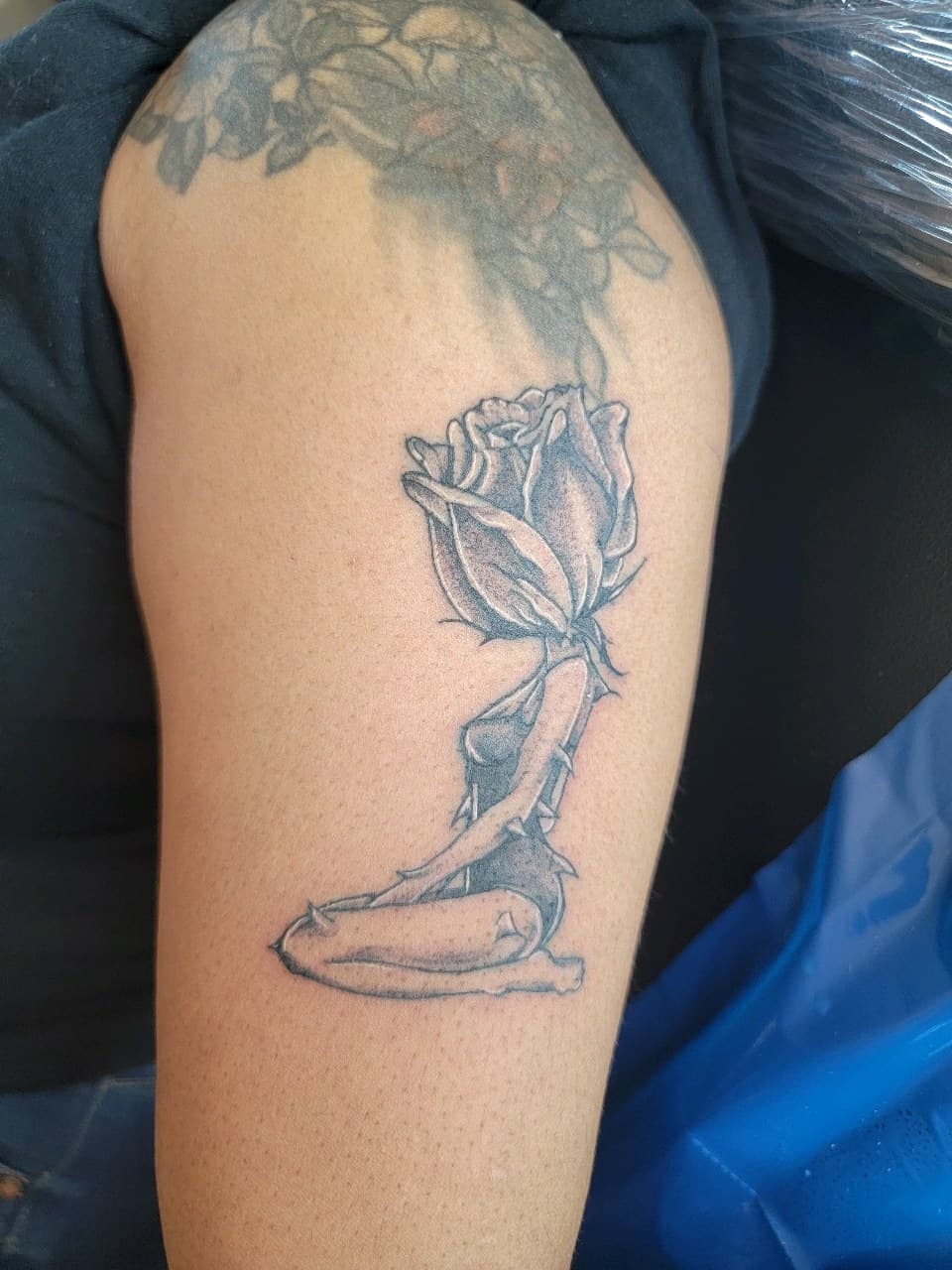 Black & Grey + Illustrative rose tattoo on Upper Arm by Dank_N_Paint on TattMe
