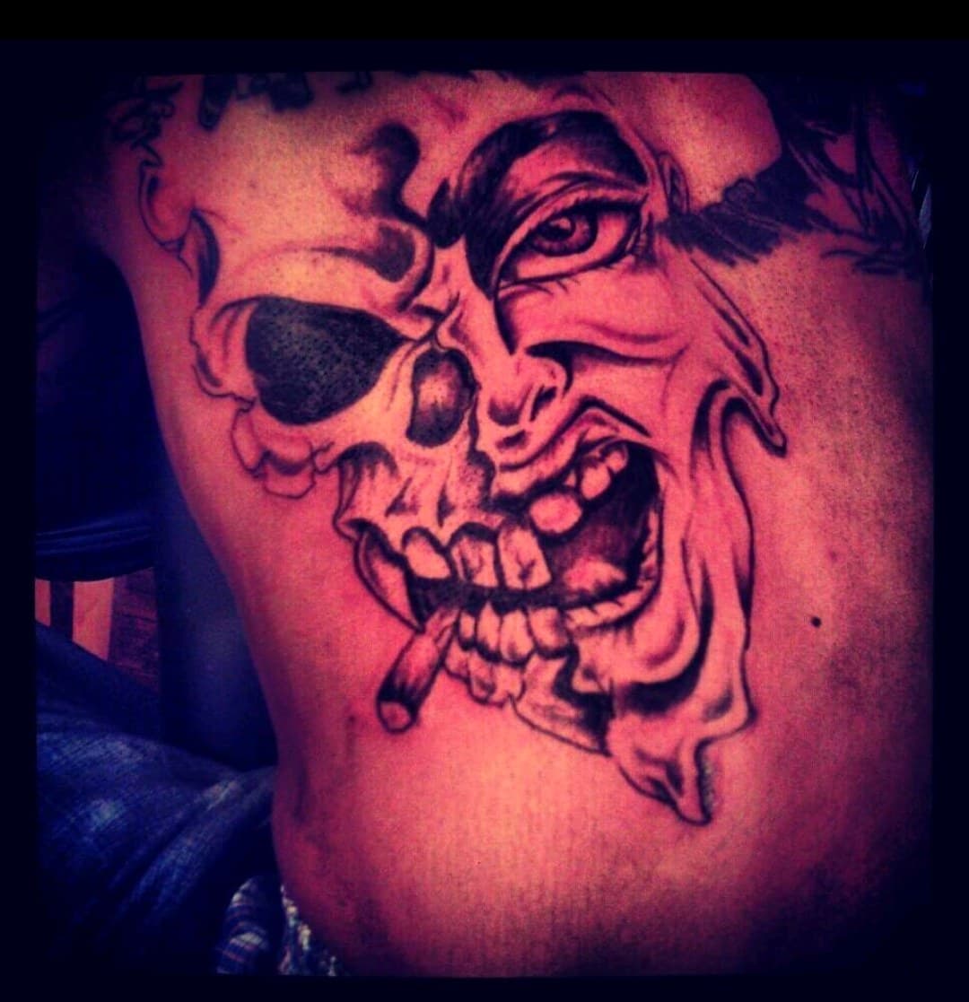 Black & Grey + Illustrative skull tattoo on Side (Torso) by Dank_N_Paint on TattMe