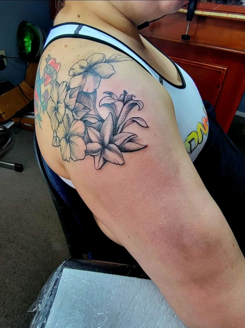 Floral + Black & Grey flowers tattoo on Upper Arm by Dank_N_Paint on TattMe