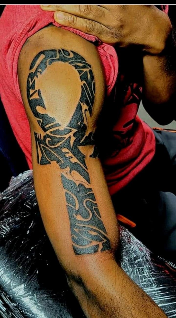 Black-work + Tribal ankh tattoo on Upper Arm by Dank_N_Paint on TattMe