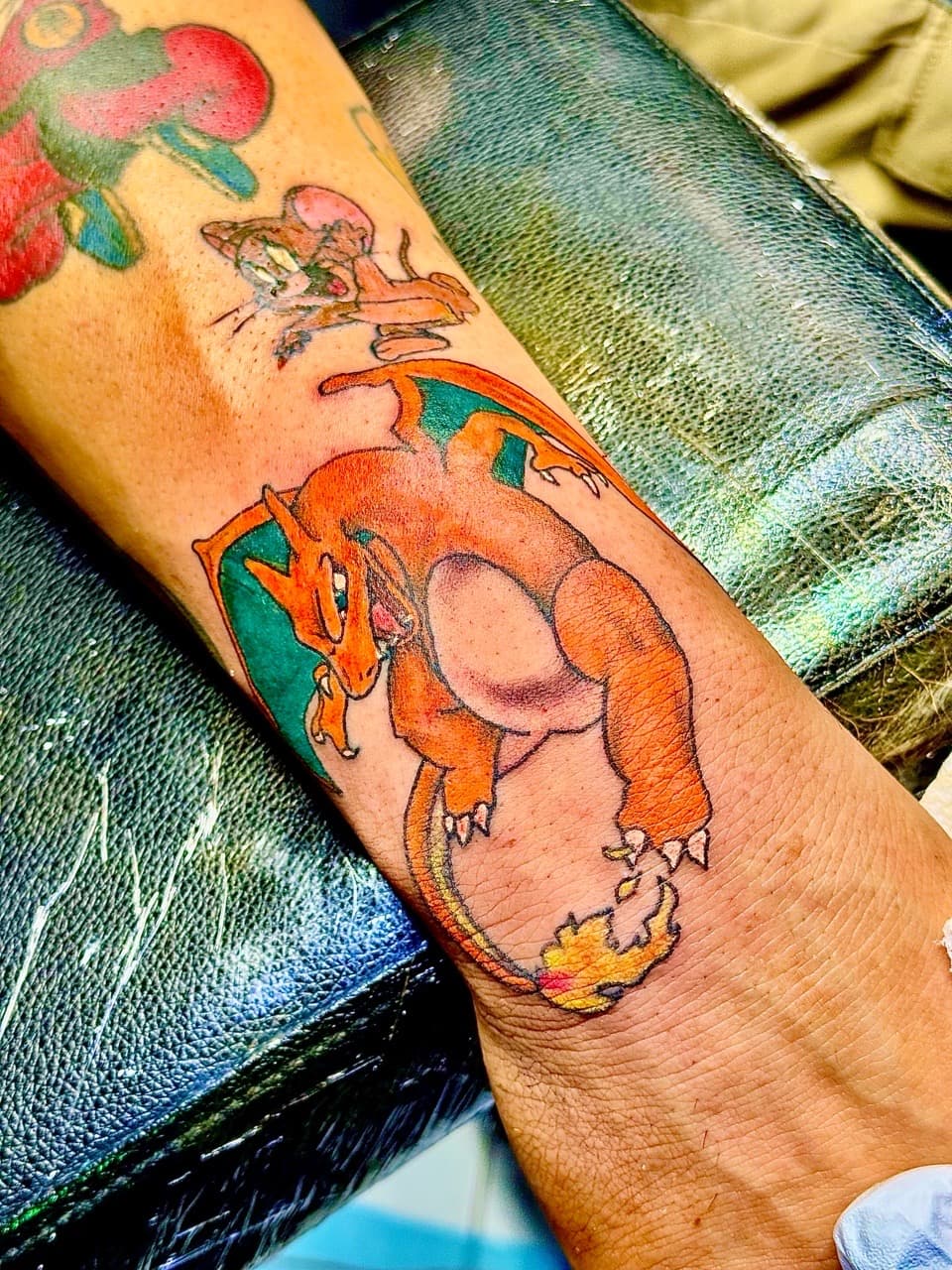 Cartoon + Color charizard tattoo on Forearm by William_Samaras on TattMe