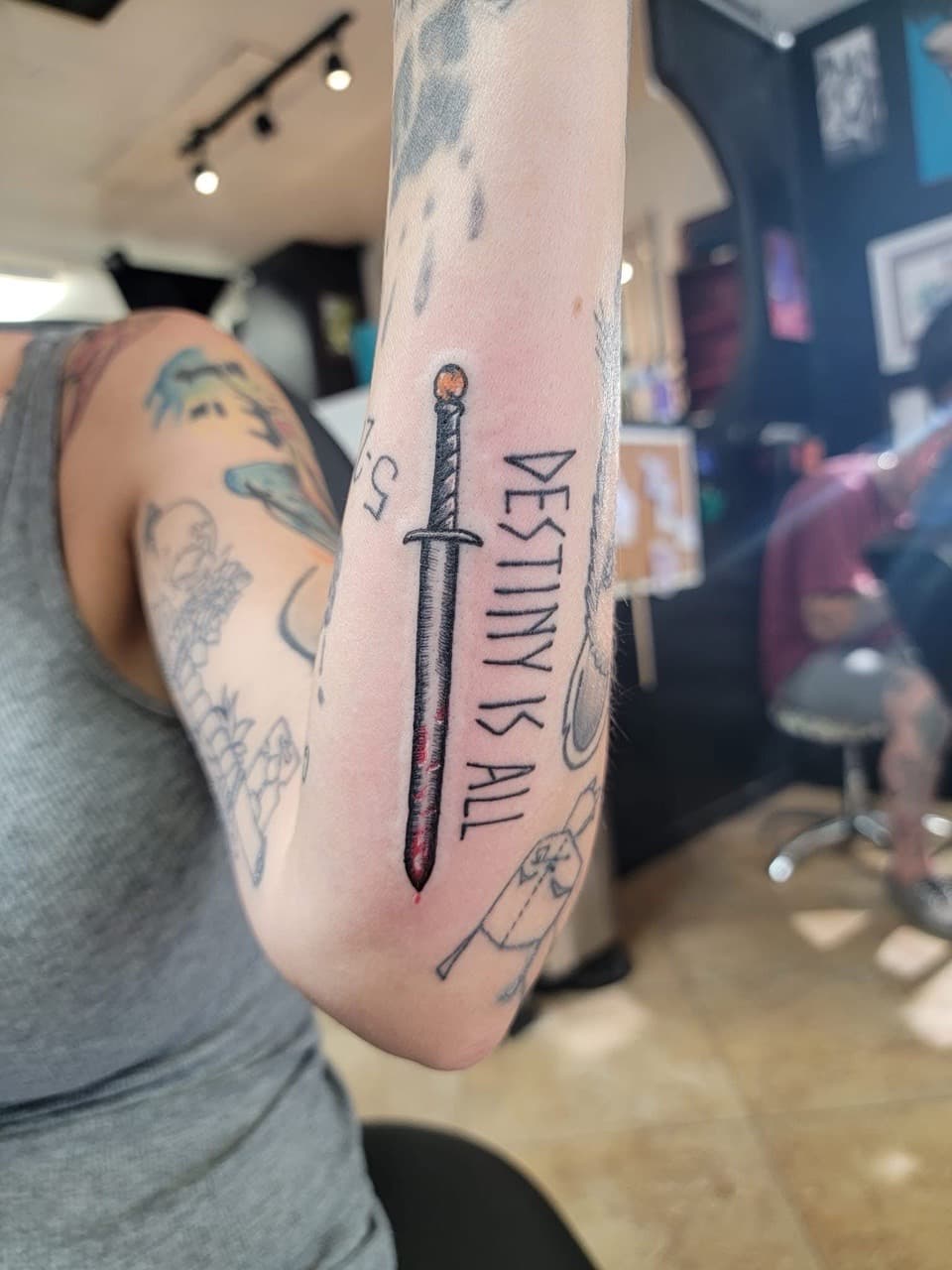 Illustrative + Lettering sword tattoo on Forearm by William_Samaras on TattMe