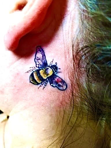 Color + Micro bee tattoo on Behind Ear by William_Samaras on TattMe