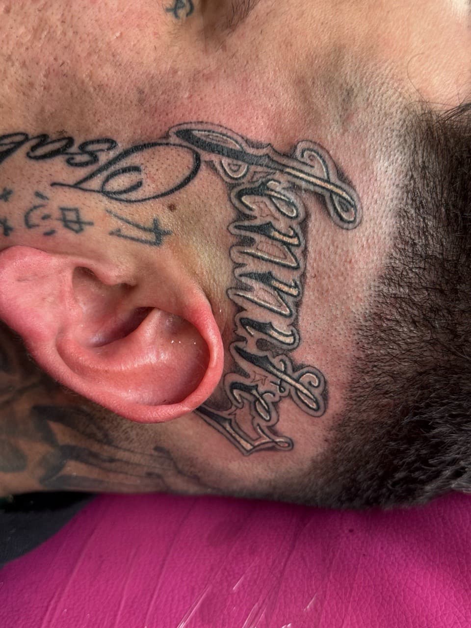 Lettering + Script name tattoo on Face by William_Samaras on TattMe