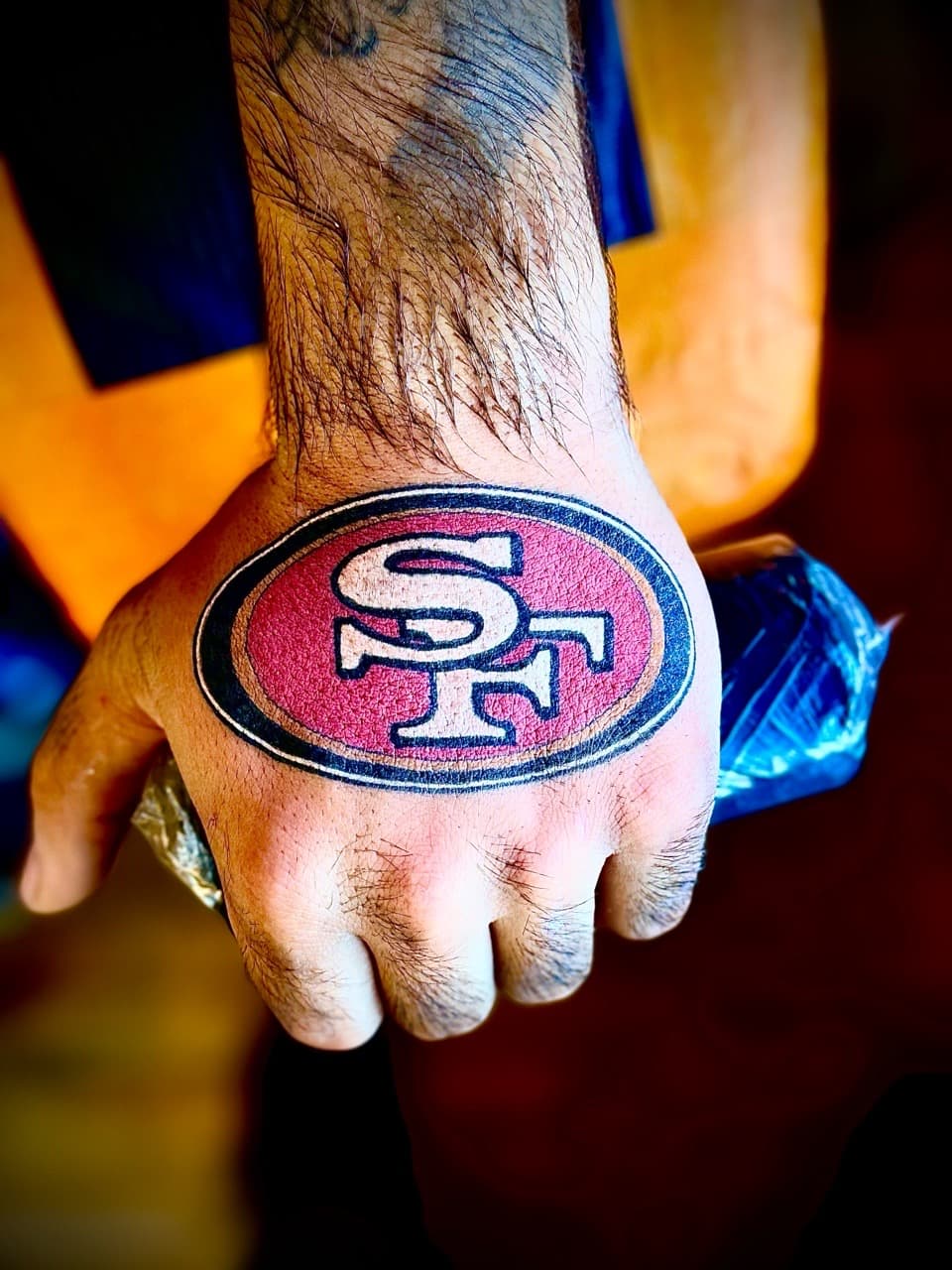 Color + Pop Culture football tattoo on Hand by William_Samaras on TattMe