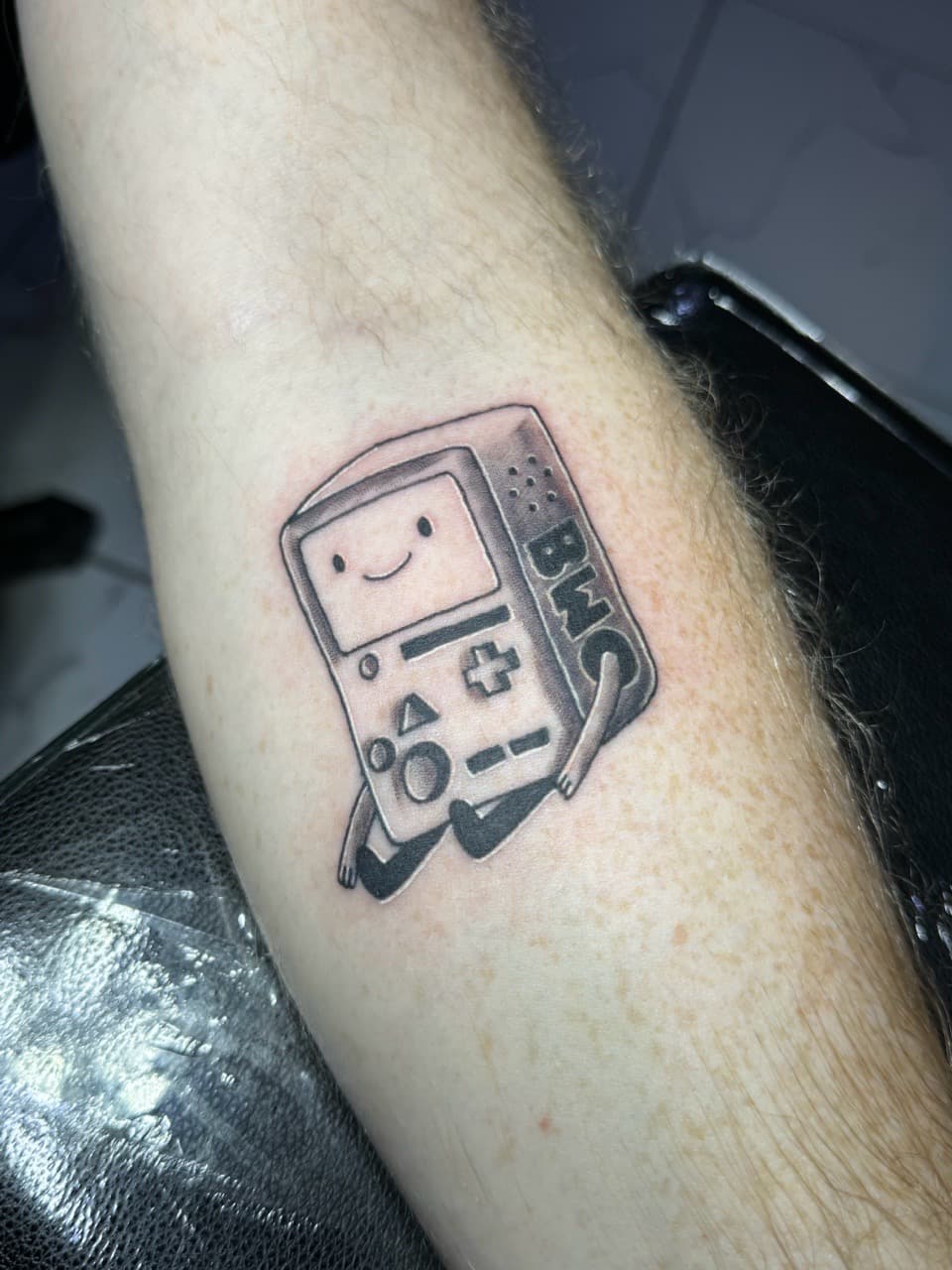 Black & Grey + Illustrative bmo tattoo on Forearm by William_Samaras on TattMe