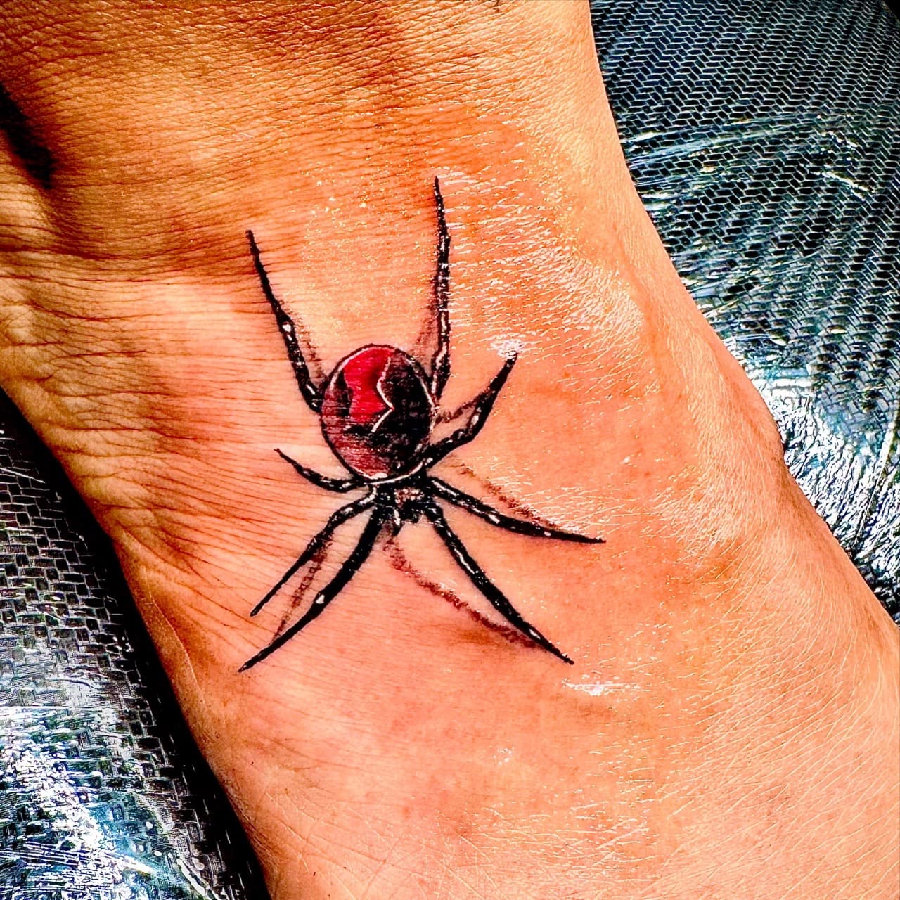 Color + Illustrative spider tattoo on Foot by William_Samaras on TattMe
