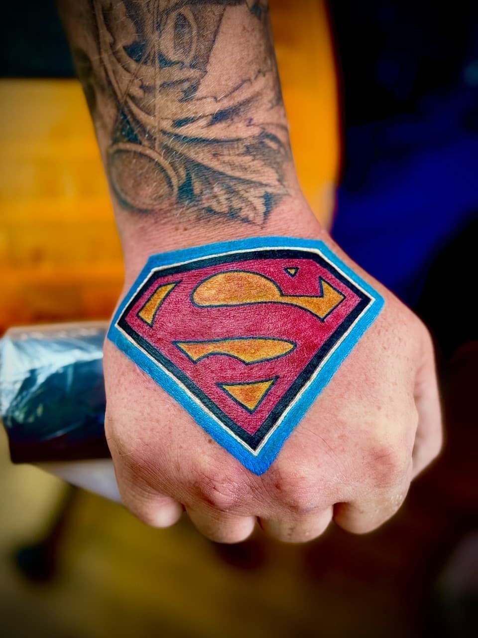 Color + Pop Culture superman tattoo on Hand by William_Samaras on TattMe