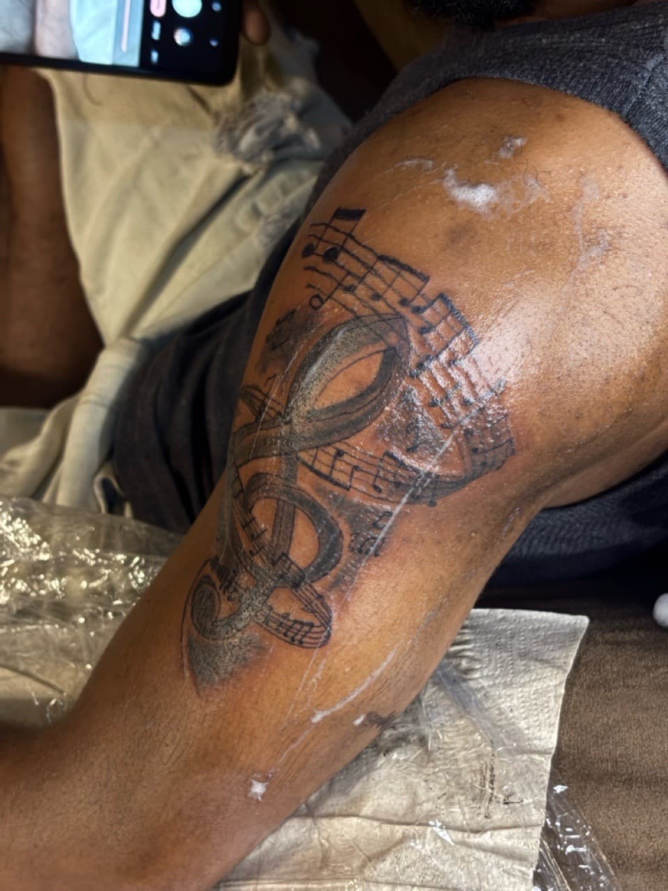 Black-work + Illustrative music notes tattoo on Upper Arm by Ai.inkedya on TattMe