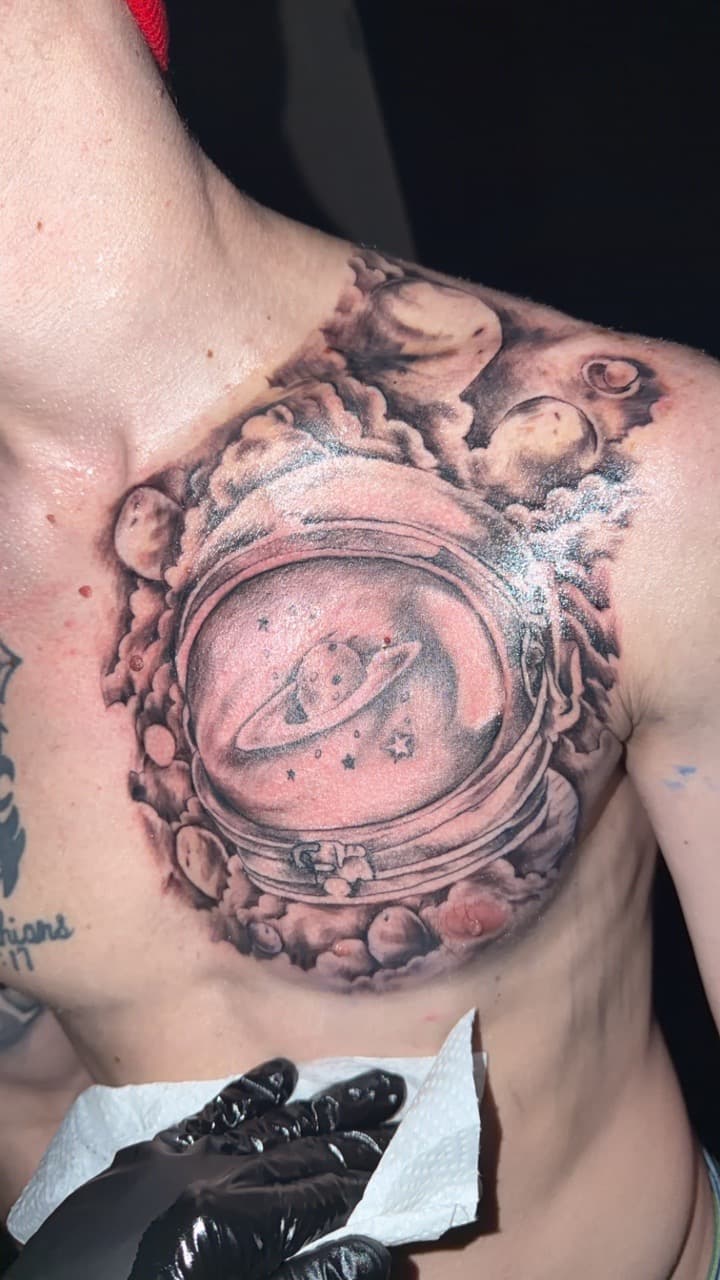 Black & Grey + Realism astronaut helmet tattoo on Chest by Studio_22 on TattMe