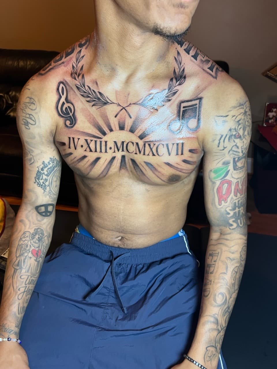 Black & Grey + Lettering roman numerals tattoo on Chest by Money_Ink_Tattoos on TattMe