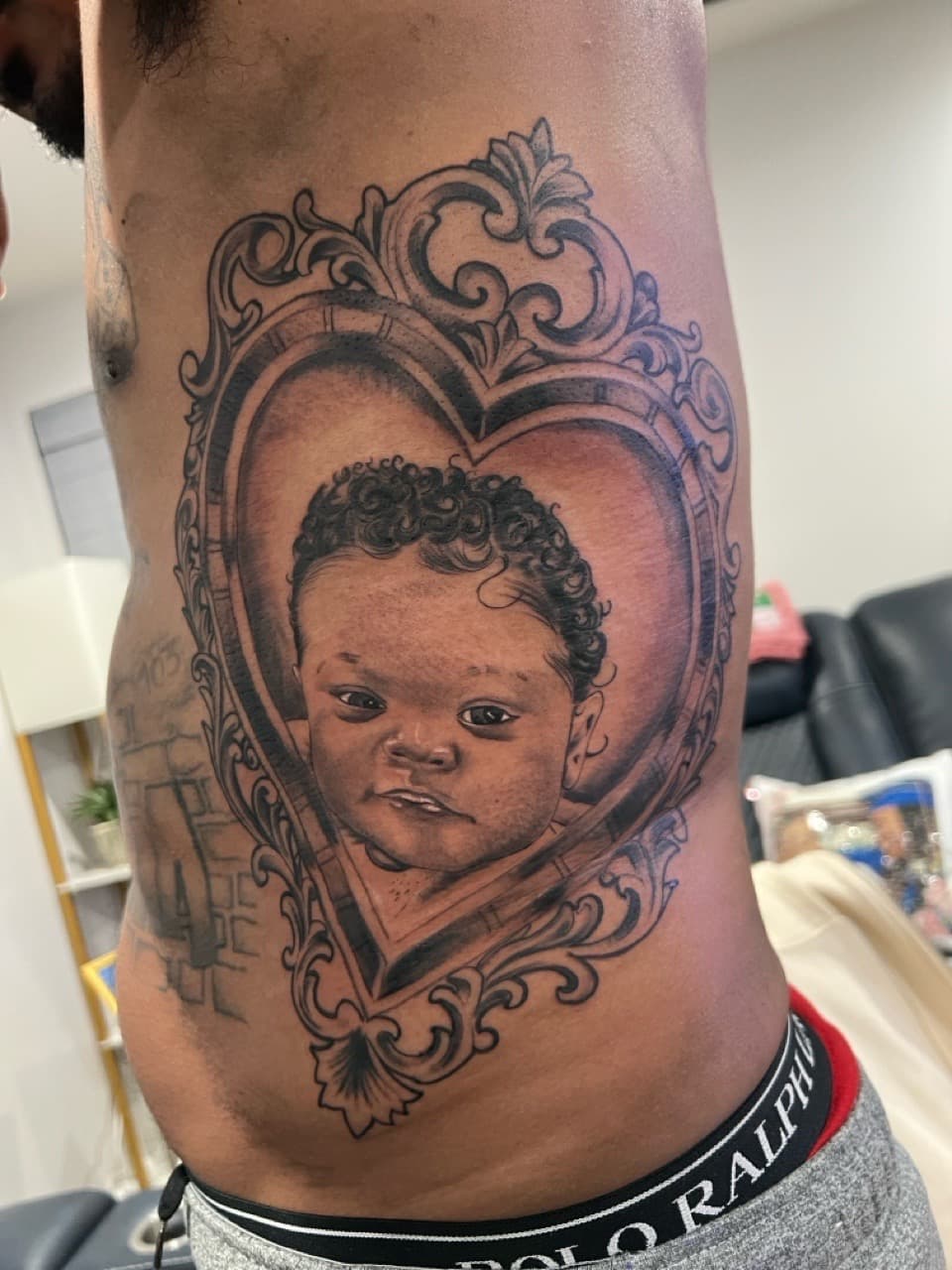Realism + Black & Grey baby tattoo on Side (Torso) by Money_Ink_Tattoos on TattMe