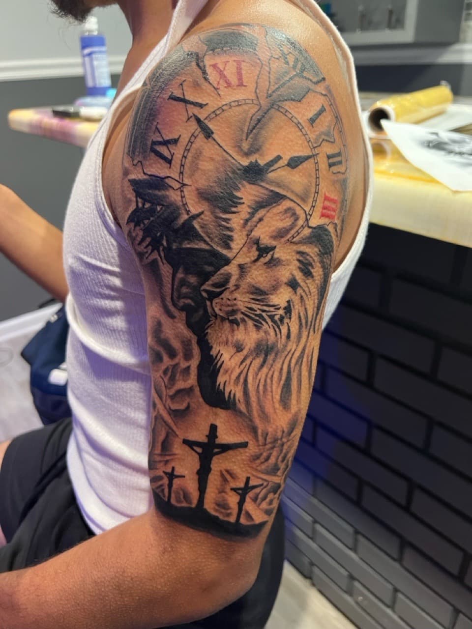 Black & Grey + Realism lion tattoo on Upper Arm by Money_Ink_Tattoos on TattMe