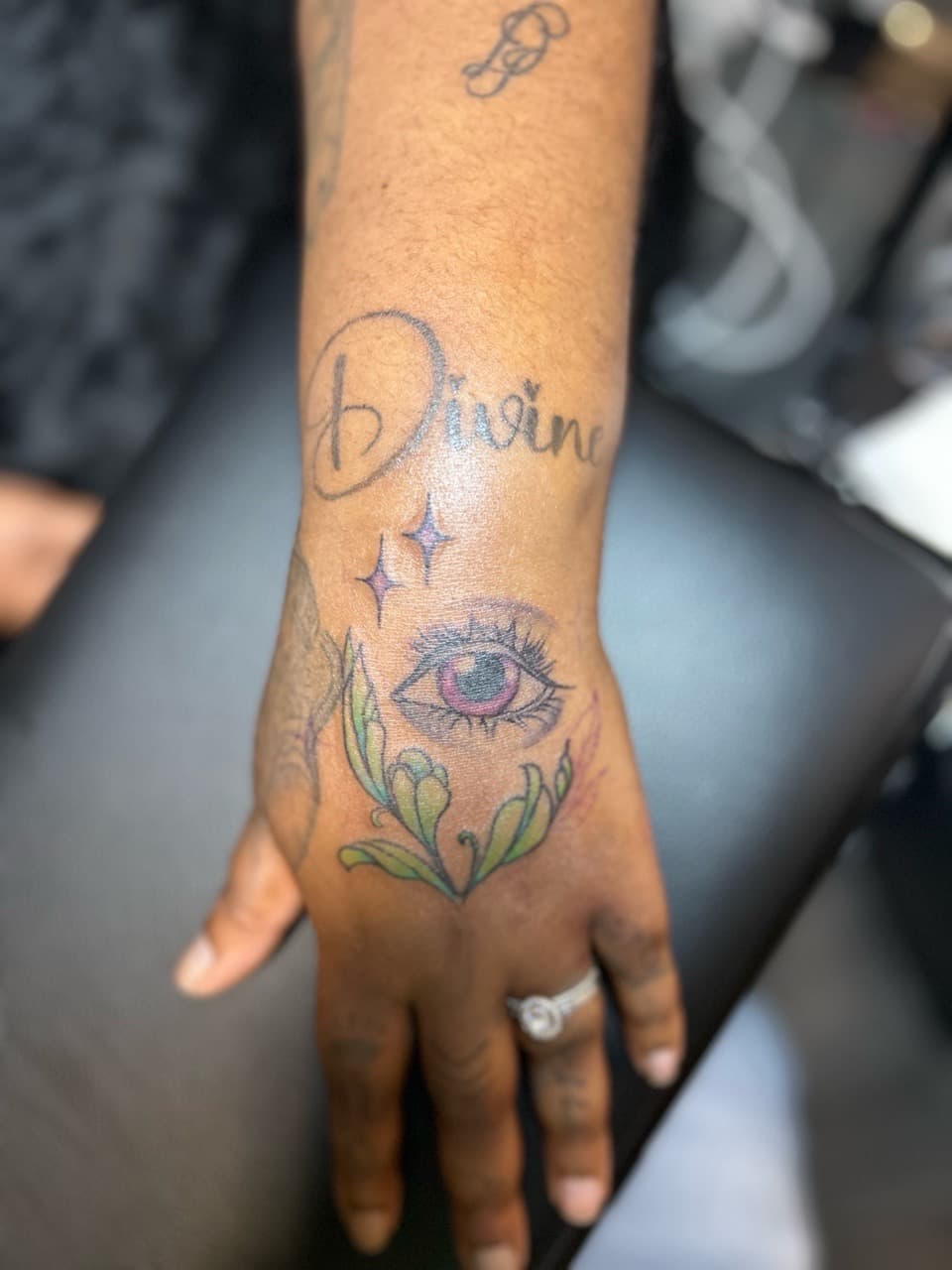 Color + Script eye tattoo on Hand by Royalty_Ink on TattMe