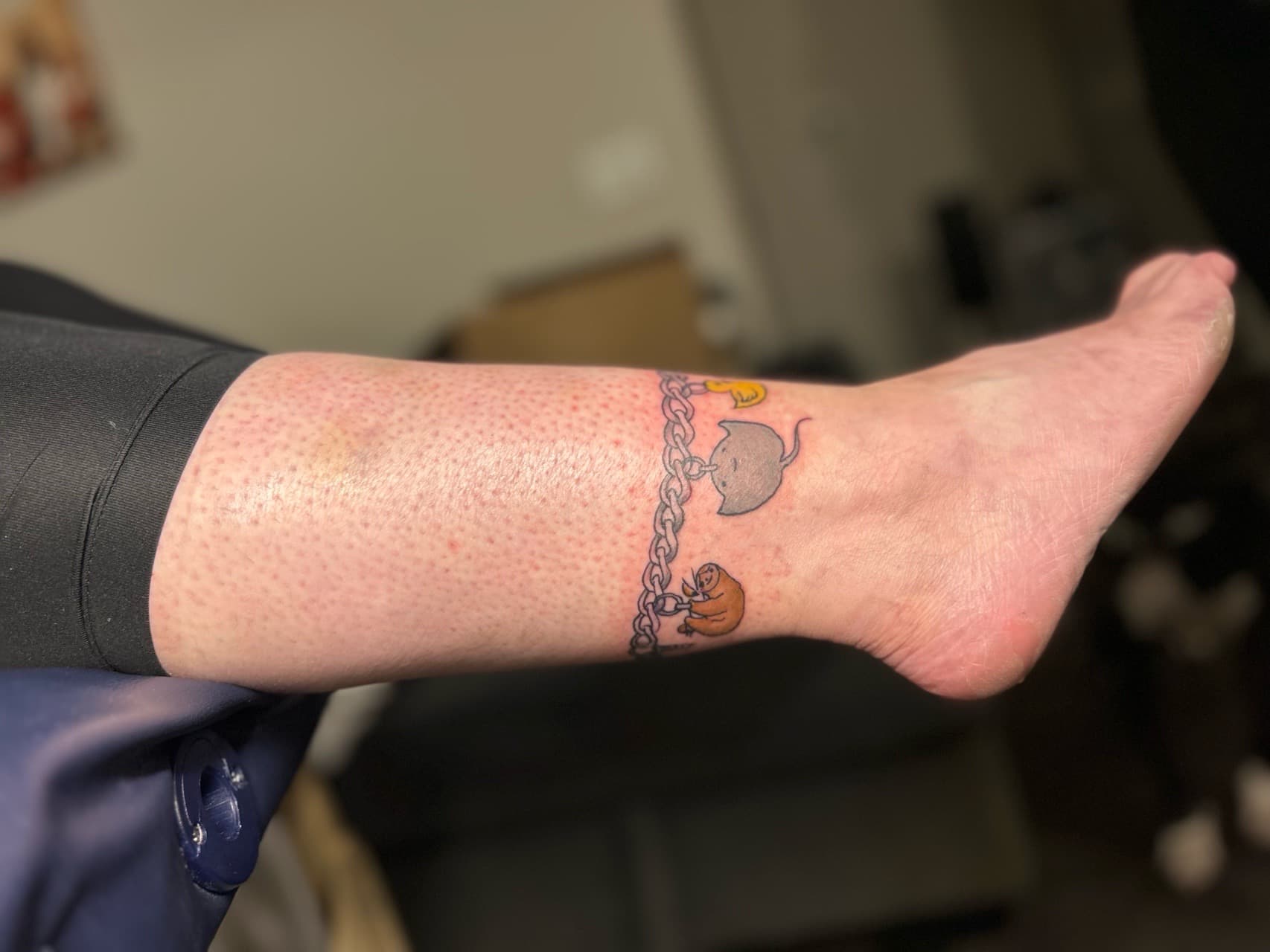 Cartoon + Color chain tattoo on Ankle by Royalty_Ink on TattMe