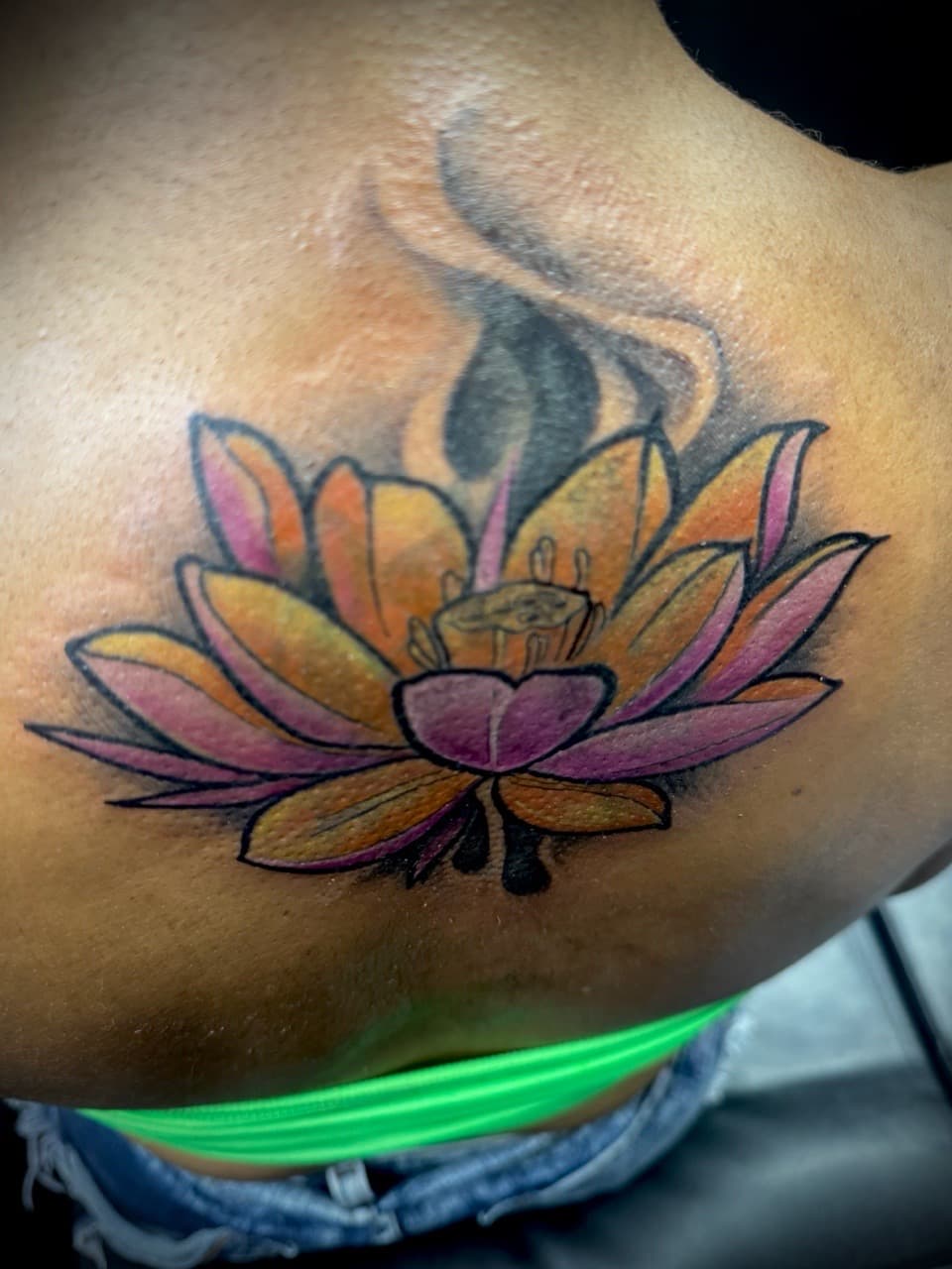 Floral + Color lotus tattoo on Shoulder Blade by Juggin_Ink_Studios on TattMe