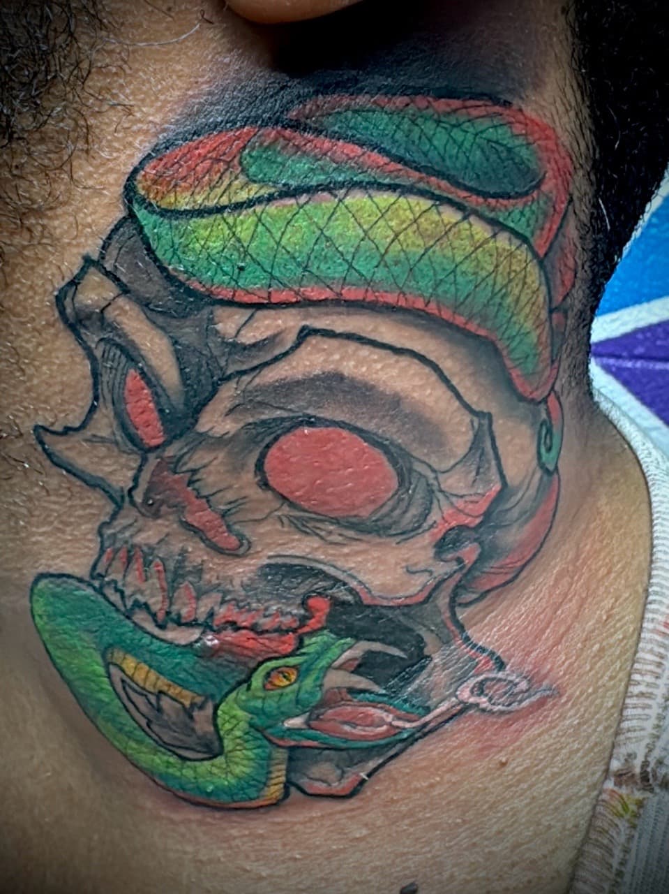 Color + Illustrative skull tattoo on Neck (Side) by Juggin_Ink_Studios on TattMe