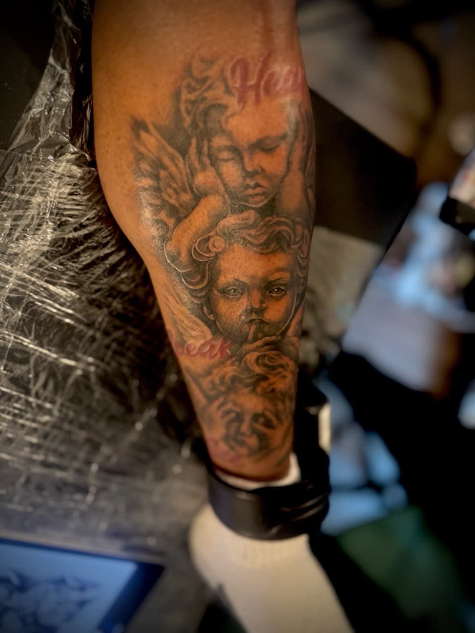 Black & Grey + Realism cherubs tattoo on Calf by Juggin_Ink_Studios on TattMe