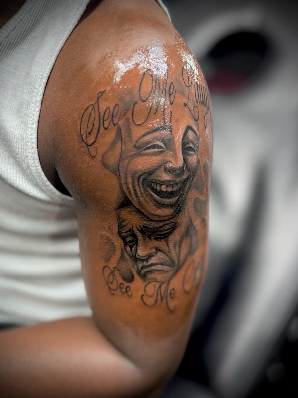 Black & Grey + Script masks tattoo on Upper Arm by Juggin_Ink_Studios on TattMe