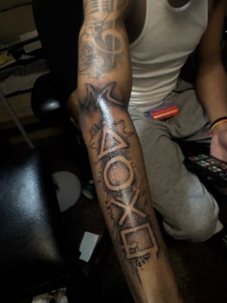 Black-work + Illustrative playstation symbols tattoo on Forearm by inkedbyleekk on TattMe