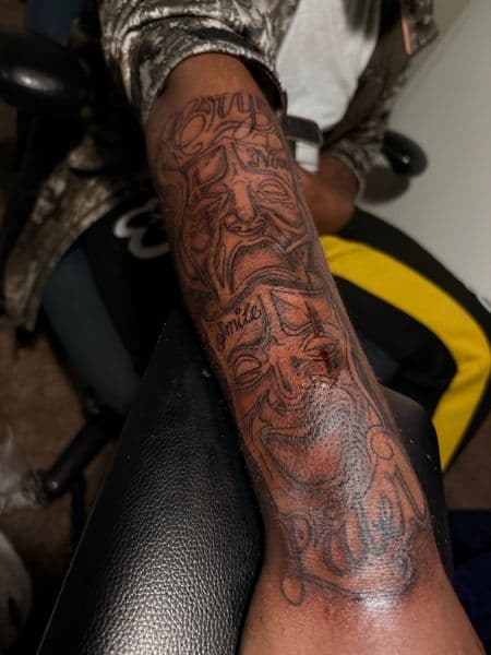Black & Grey + Illustrative masks tattoo on Forearm by inkedbyleekk on TattMe