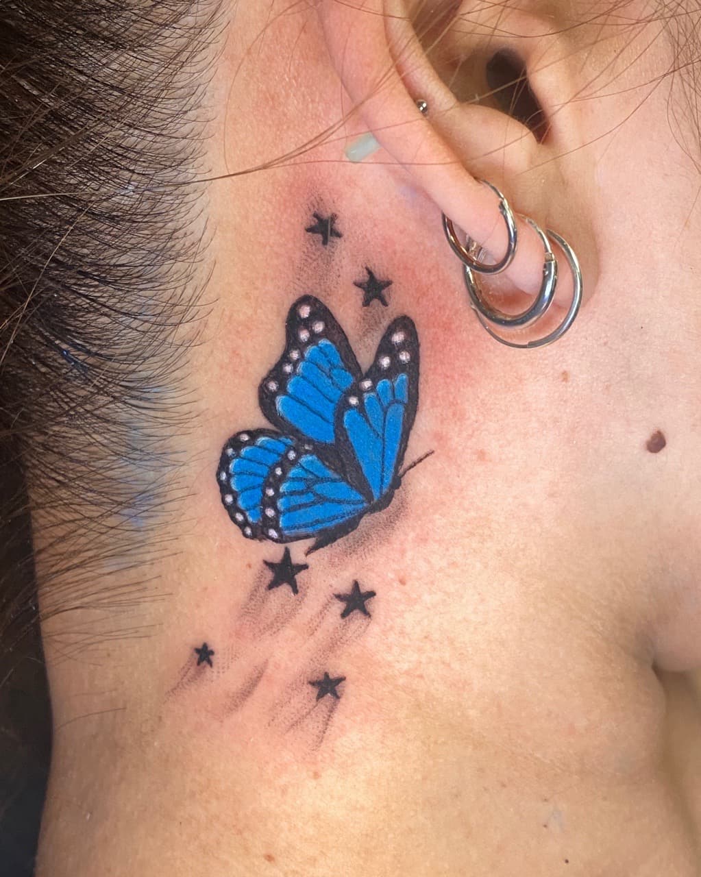 Color + Illustrative butterfly tattoo on Behind Ear by ArtIsTatts on TattMe