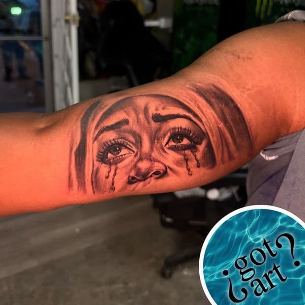 Black & Grey + Realism face tattoo on Upper Arm by ArtIsTatts on TattMe