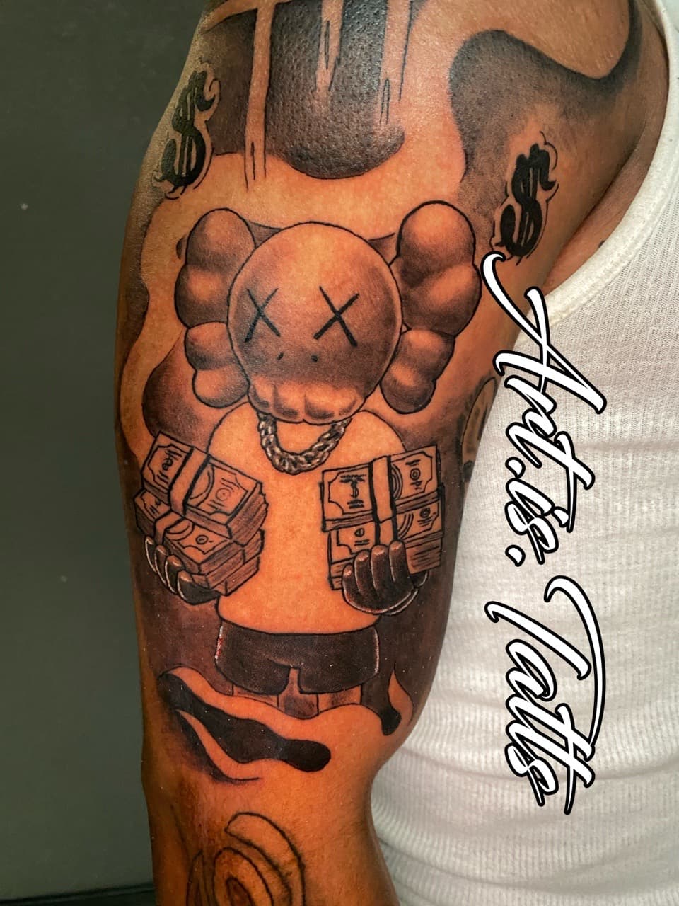 Pop Culture + Illustrative money tattoo on Upper Arm by ArtIsTatts on TattMe